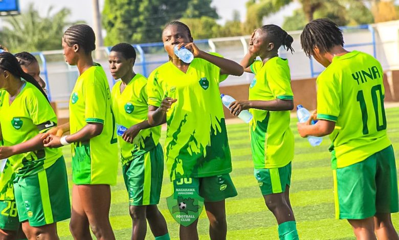 Nasarawa Amazons players take a cooling break during their NWFL match against Confluence Queens as they battle for Super 6 qualification.