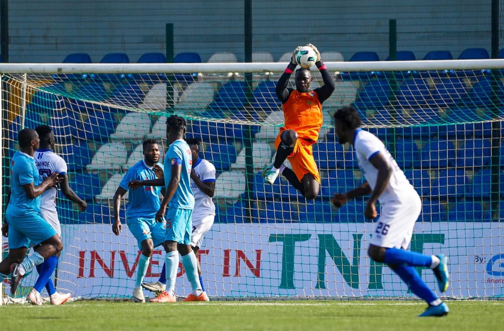 Shooting Stars goalkeeper makes a crucial save during a tense moment in the penalty area against Remo Stars.