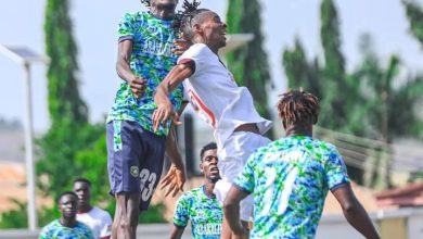 Abakaliki FC and Ikorodu City FC players competing for an aerial ball during the 2025 Nigeria Federation Cup semi-final.