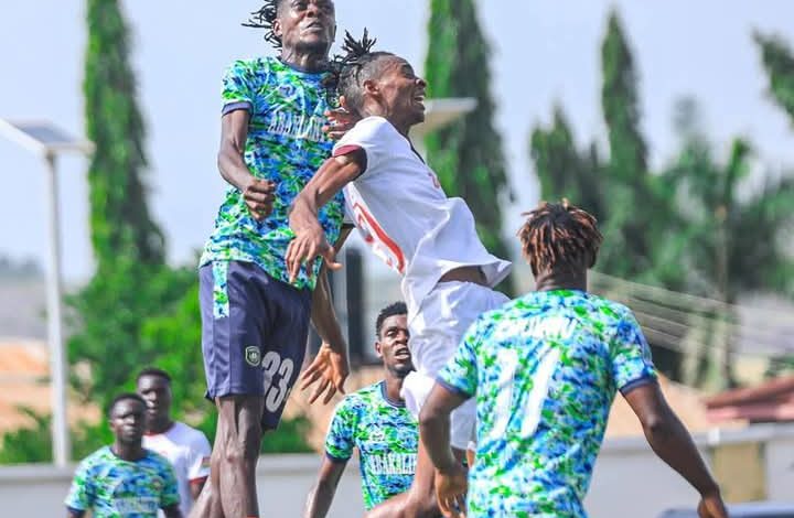 Abakaliki FC and Ikorodu City FC players competing for an aerial ball during the 2025 Nigeria Federation Cup semi-final.