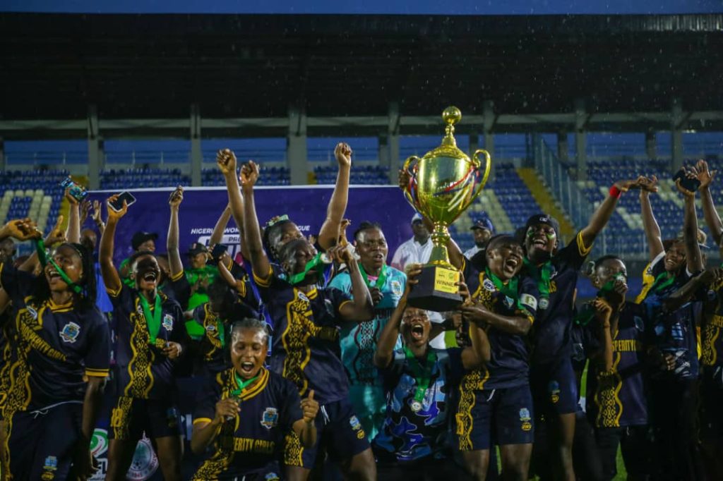 Bayelsa Queens players celebrating with the NWFL Premiership trophy and medals after winning the 2024/25 Super Six playoffs.