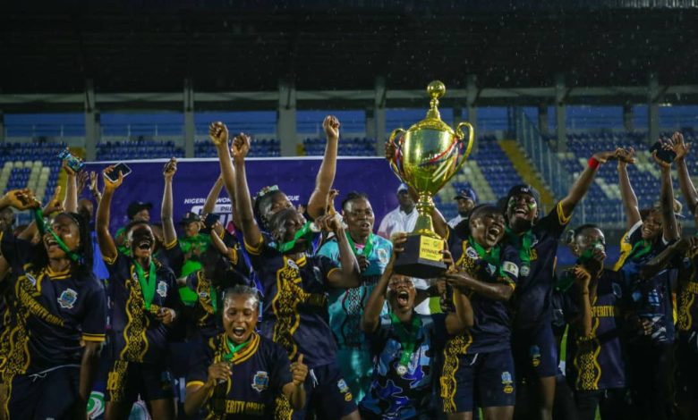 Bayelsa Queens players celebrating with the NWFL Premiership trophy and medals after winning the 2024/25 Super Six playoffs.