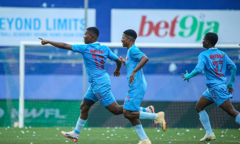 Bolaji Olamide celebrates her goal with hand raised as her Remo Stars Ladies teammates run towards her, smiling and cheering during the NWFL Super 6 match in Ikenne