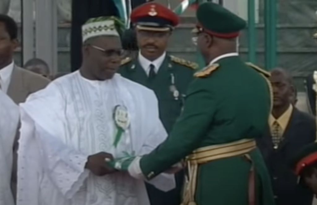 President Olusegun Obasanjo receives the Nigerian Constitution during his swearing-in ceremony on May 29, 1999