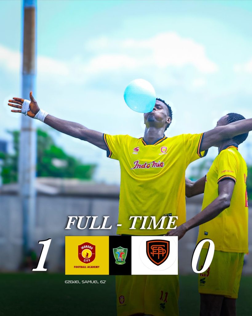 Ezekiel Samuel celebrates his goal against Switch FC with a balloon in his mouth
