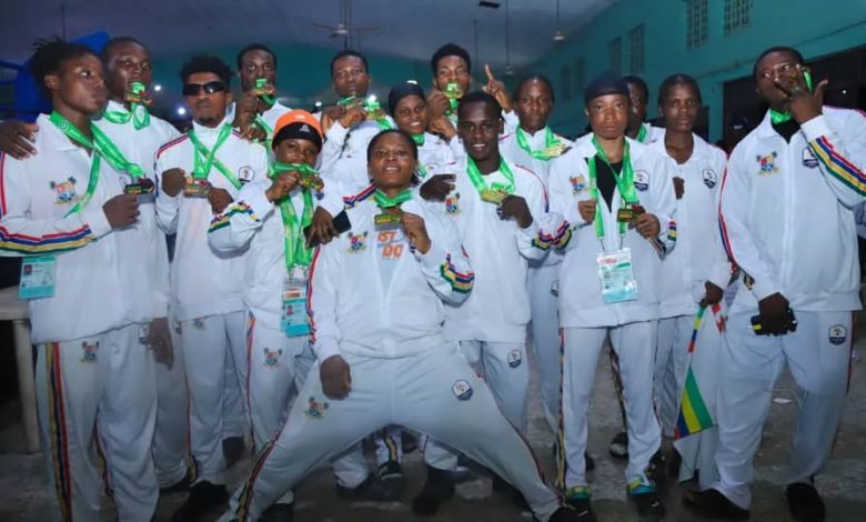 Lagos State boxers in official tracksuits proudly wearing their medals at Gateway Games 2024, celebrating victory with smiles and excitement.
