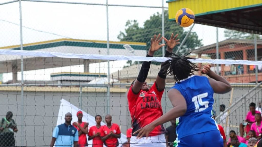 Volleyball players from Team Lagos and Team Nasarawa in action during their match at the 22nd National Sports Festival in Ogun State, showcasing intense competition on the court.