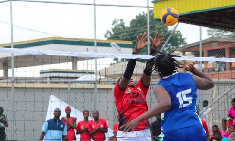 Volleyball players from Team Lagos and Team Nasarawa in action during their match at the 22nd National Sports Festival in Ogun State, showcasing intense competition on the court.