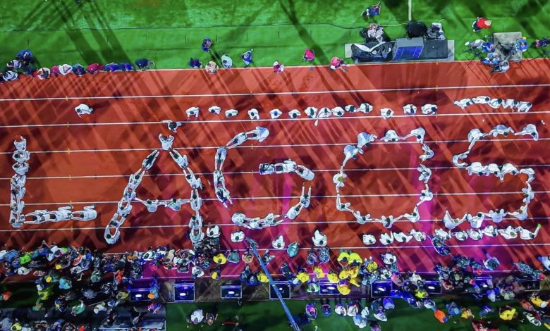 Lagos State athletes in vibrant uniforms performing a colorful display at the Gateway Games 2025 Opening Ceremony in Abeokuta