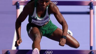 Tobi Amusan mid-air over a hurdle during her record-breaking 100m hurdles race at the Rabat Diamond League.