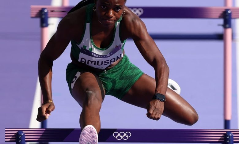 Tobi Amusan mid-air over a hurdle during her record-breaking 100m hurdles race at the Rabat Diamond League.