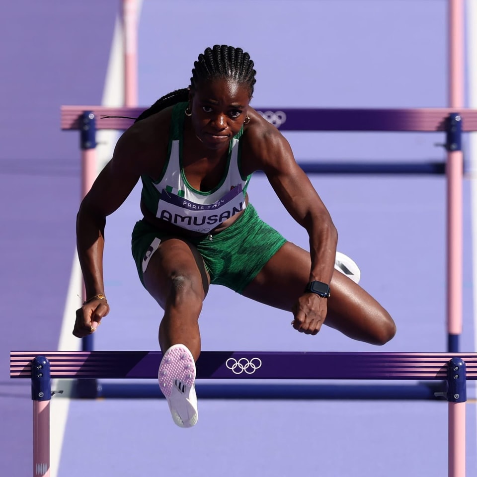 Tobi Amusan Breaks Meeting Record with Dominant 12.45s Win at Rabat Diamond League Tobi Amusan mid-air over a hurdle during her record-breaking 100m hurdles race at the Rabat Diamond League.