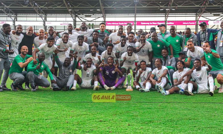 Nigeria players and officials celebrate with the Unity Cup trophy after their 5-4 penalty shootout victory over Jamaica at Gtech Community Stadium in London.