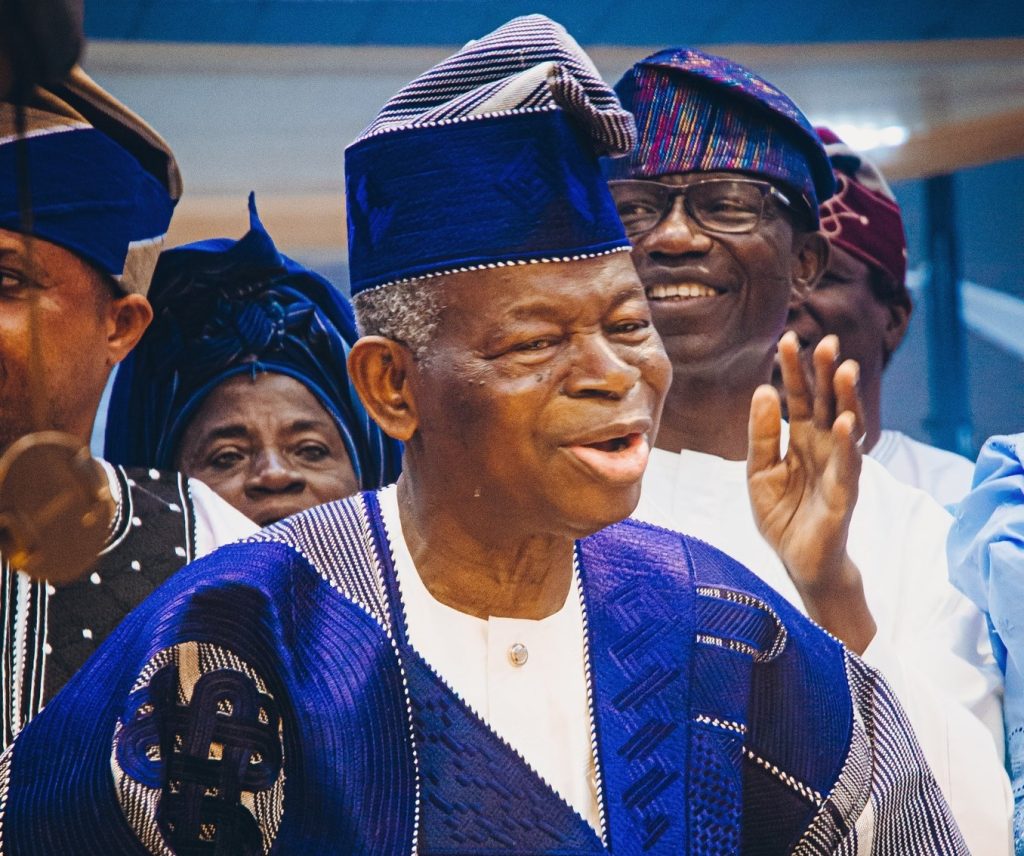 Pastor Elijah Oludele Abina dancing joyfully at his 90th birthday celebration surrounded by church members