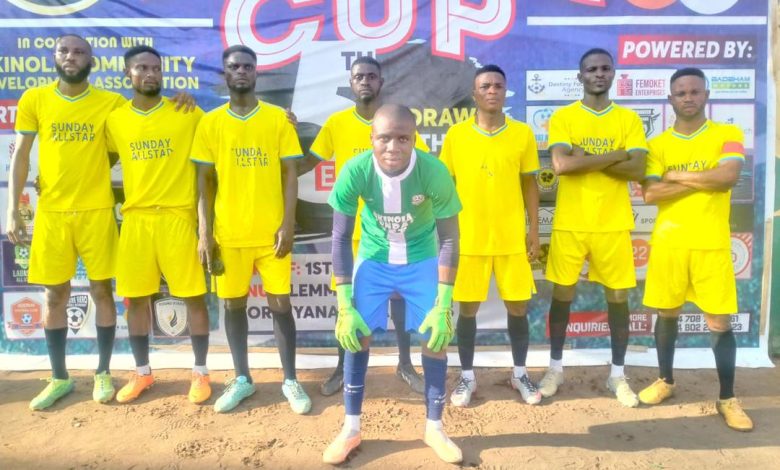 Akinola Sunday Set players lined up before their Peace Cup 2025 match against FC Shindara, wearing their bright orange kits on a sunny afternoon.