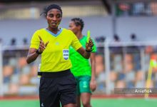 Akintoye Yemisi officiating a match at the NWFL 2024 Super 6 in Nigeria, wearing a referee uniform, focused on the game.