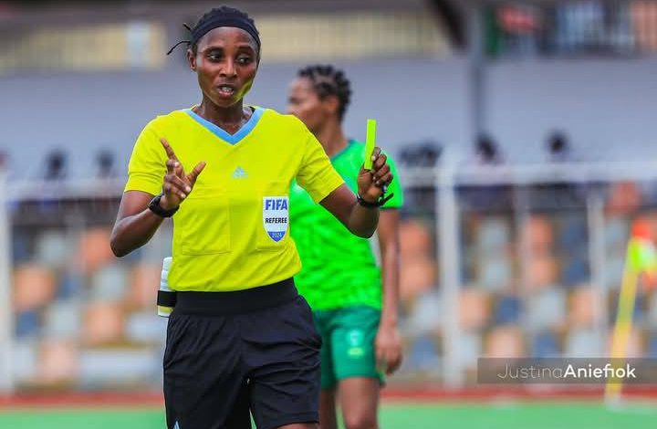 Akintoye Yemisi officiating a match at the NWFL 2024 Super 6 in Nigeria, wearing a referee uniform, focused on the game.