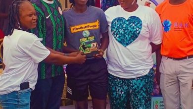 Ashade Senami receiving an award from Hon. Mobolaji Ogunlede, Lagos State Commissioner for Youth and Social Development, during a football event organized by the RAK Development Foundation.