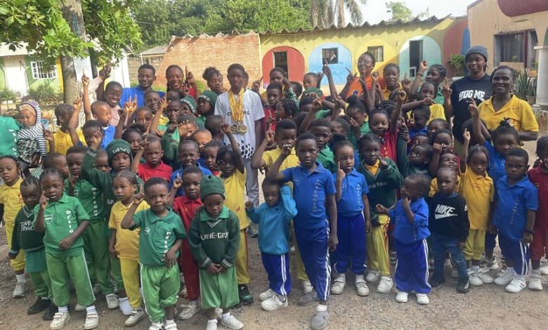 Bernice Onoriode with the pupils of her former school