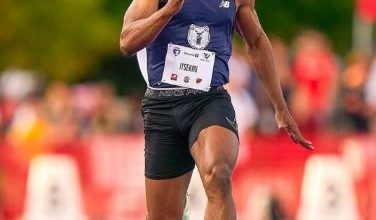 Usheoritse Itsekiri preparing to sprint on the track at an international athletics meet.