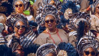 Elegant Yoruba women in vibrant iro and buba ensembles with matching gele, seated gracefully and attentively watching the cultural festivities at the Ojude Oba Festival 2025 in Ijebu-Ode, Ogun State, Nigeria.