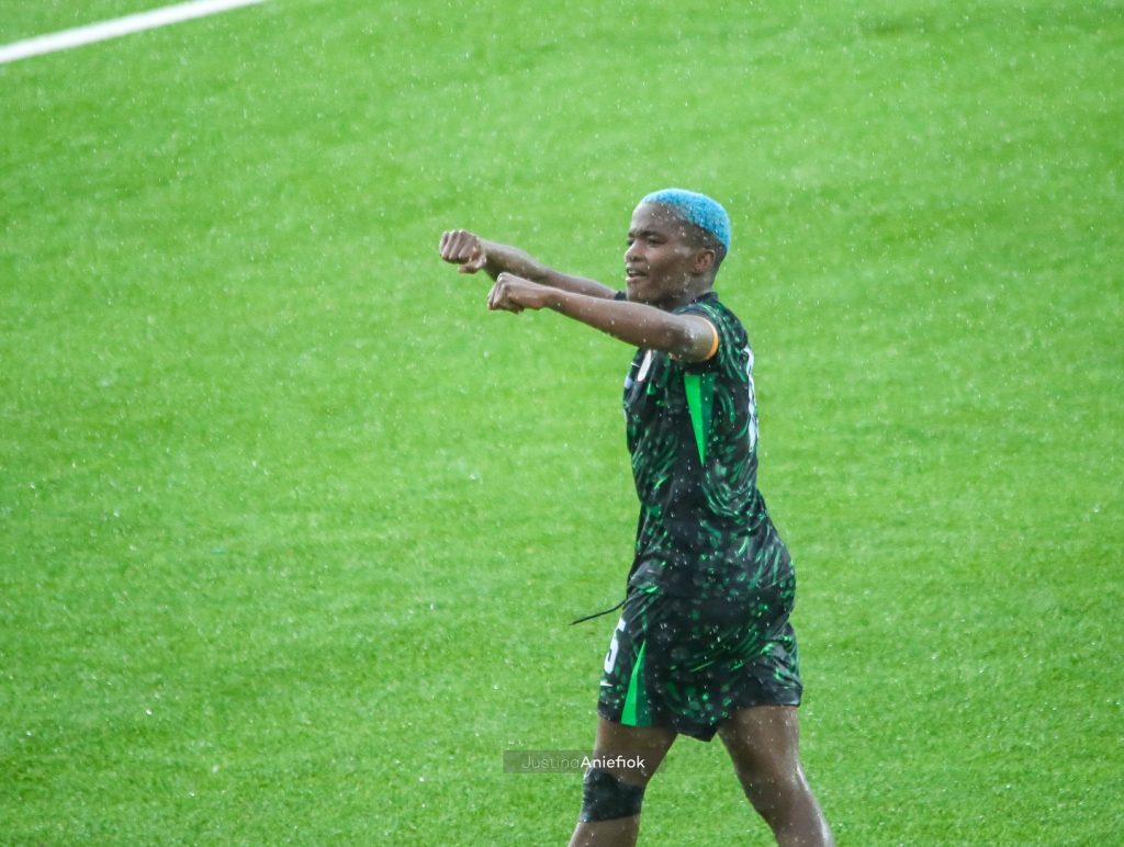 Rasheedat Ajibade celebrates her goal against Cameroon with a triumphant fist pump at the MKO Abiola Stadium