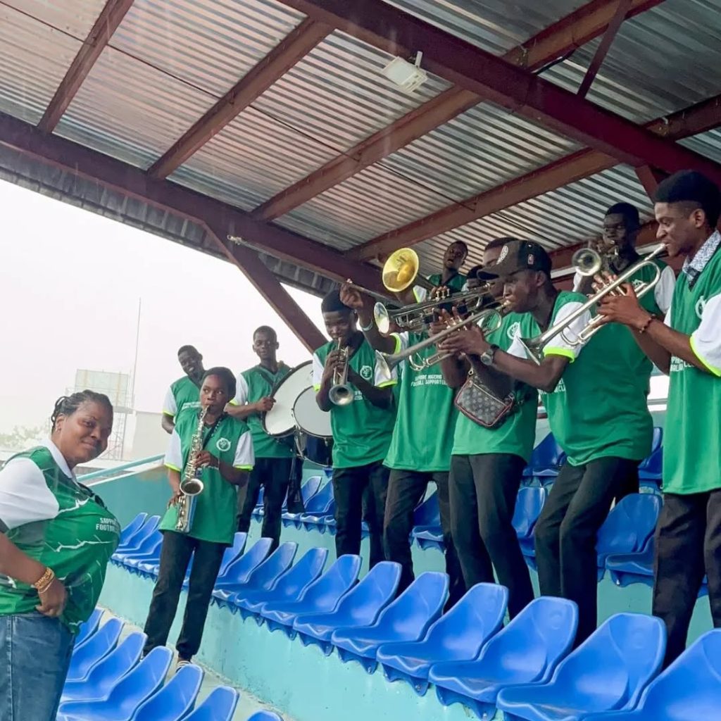 Members of Sapphire Nigeria Women Football Supporters Club passionately cheering from the stands, led by their President, Jadesola