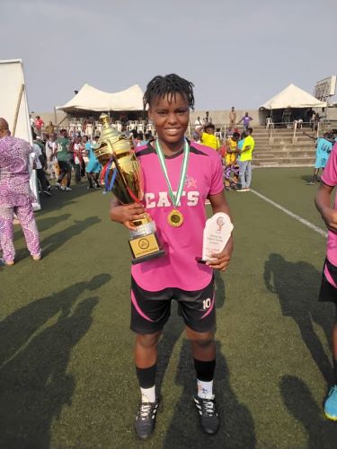 Julianah James Shines as MVP in Lagos Women’s State League Final Julianah James smiling and holding the Lagos Women’s State League trophy, MVP plaque, and wearing her gold medal around her neck.