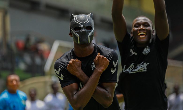Akinocho Merveille of Beyond Limits FA celebrates his decisive goal in the TCC Super Cup final with a mask covering his face at Mobolaji Johnson Arena, Lagos.