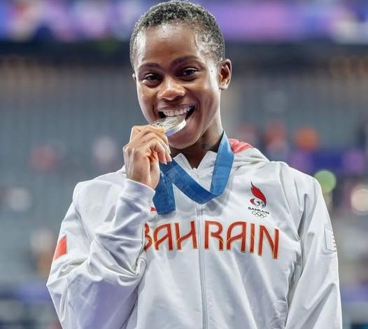 Salwa Eid Naser bites her gold medal after winning the Zurich Diamond League women’s 400m.