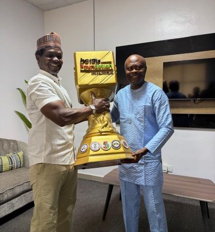 Hajji Liameed Gafar presented the Ex-International Trophy to Honourable Kunle Soname